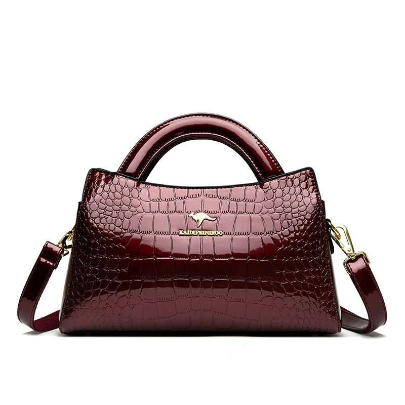 Soft leather handbag with curved top edge