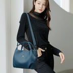 Leather handbag with wide base