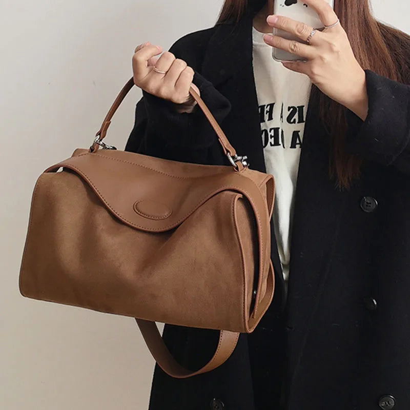 Suede handbag with subtle colors