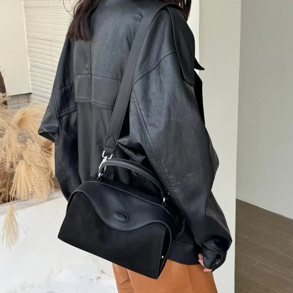 Suede handbag with subtle colors