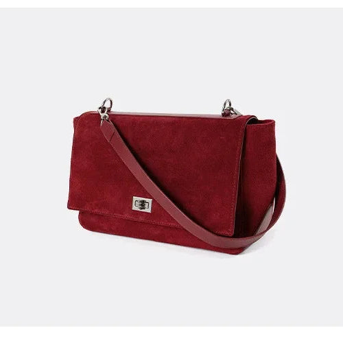 Textured suede handbag with flap closure