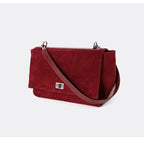 Textured suede handbag with flap closure