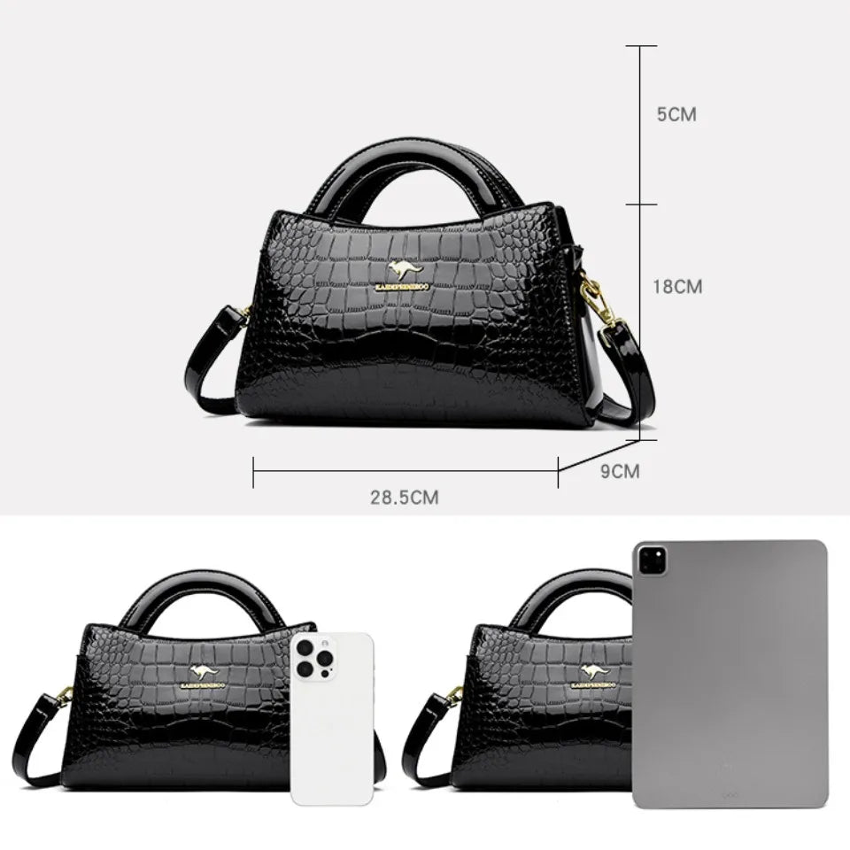 Soft leather handbag with curved top edge