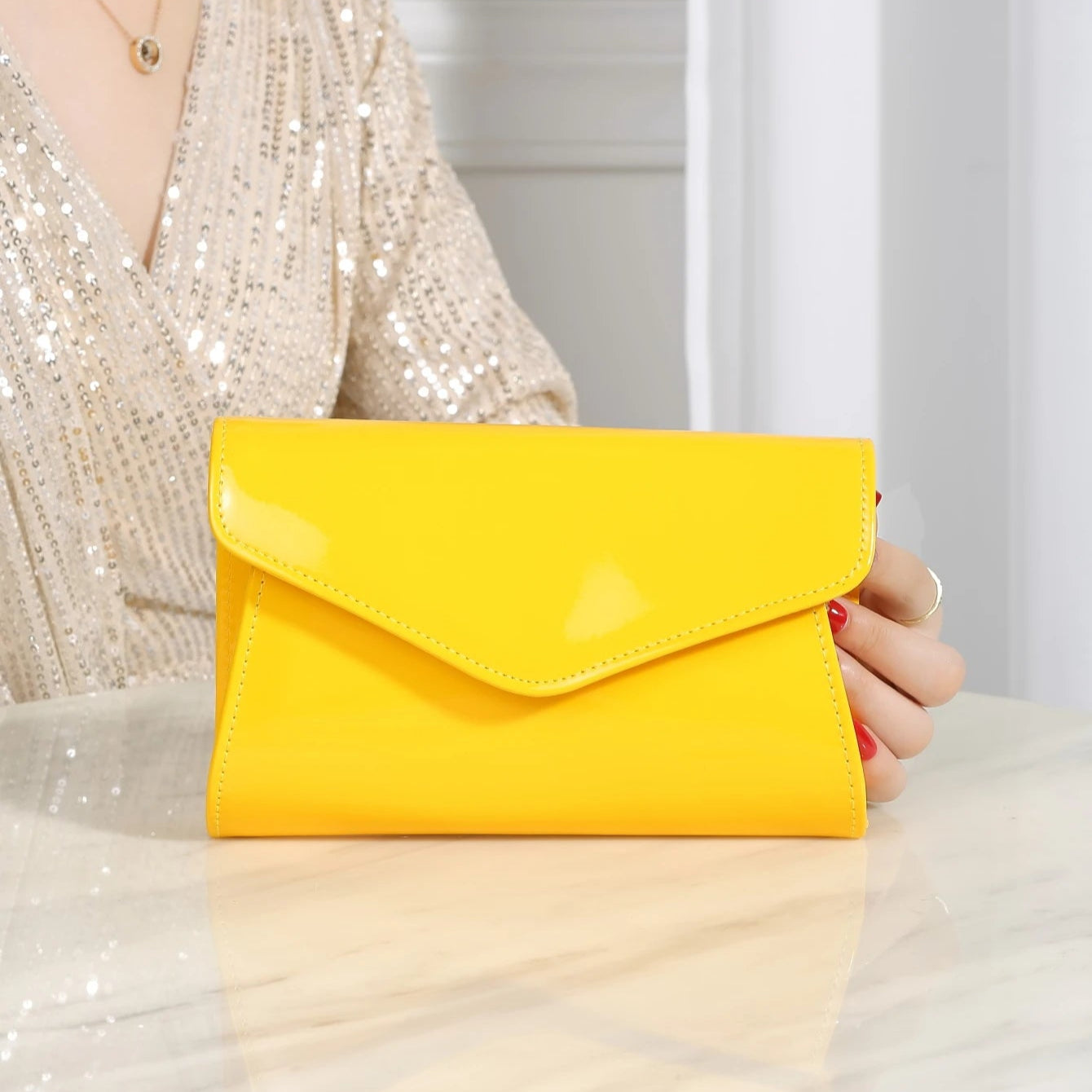 Minimal leather handbag with slim profile
