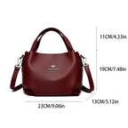 Leather handbag with wide base