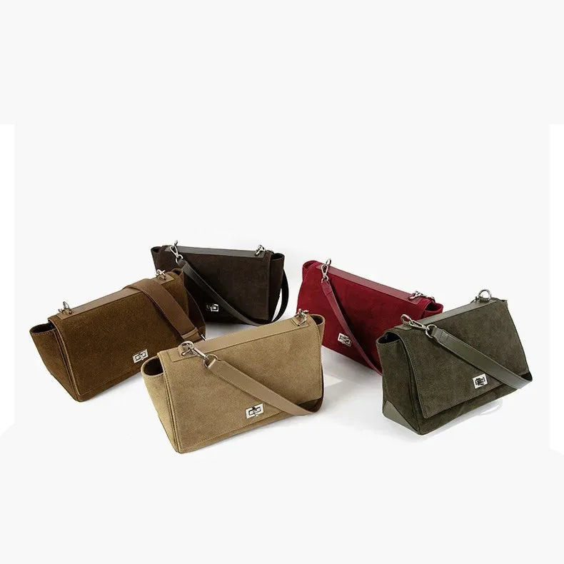 Textured suede handbag with flap closure