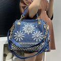 Amblot A Elegant floral embroidered denim handbag with chain handle