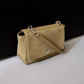 Amblot Beige Textured suede handbag with flap closure