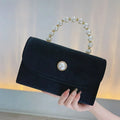 Amblot Black Corduroy clutch bag with envelope flap design