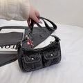 Amblot Black Denim handbag with front pockets