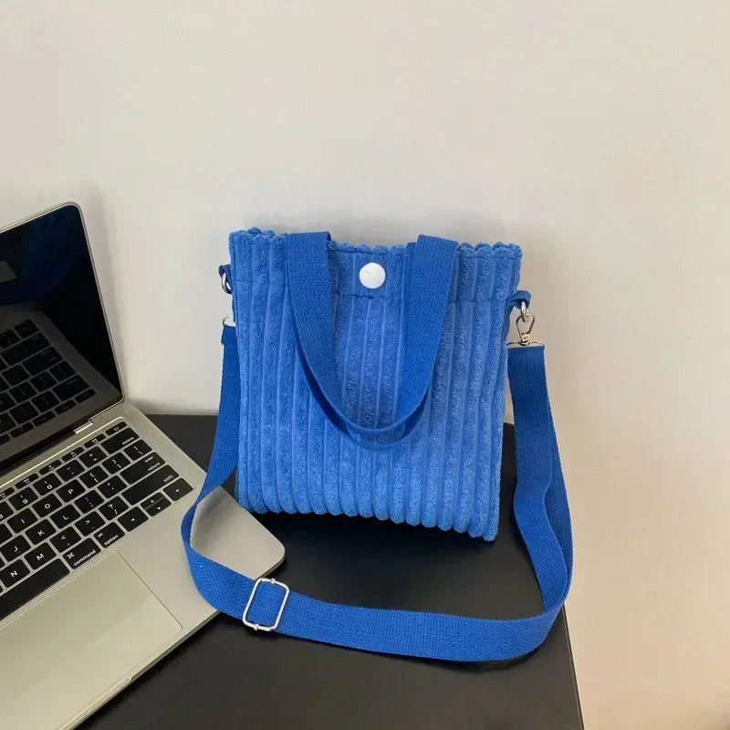 Amblot Blue Corduroy handbag with front button detail