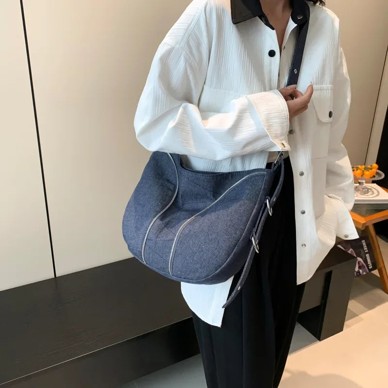 Amblot Blue Soft washed denim shoulder bag with casual fold design