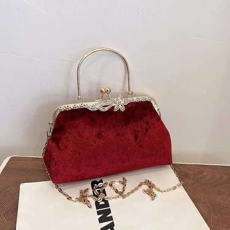 Amblot Burgundy Corduroy evening clutch bag with wrist strap