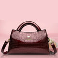 Amblot Burgundy Soft leather handbag with curved top edge