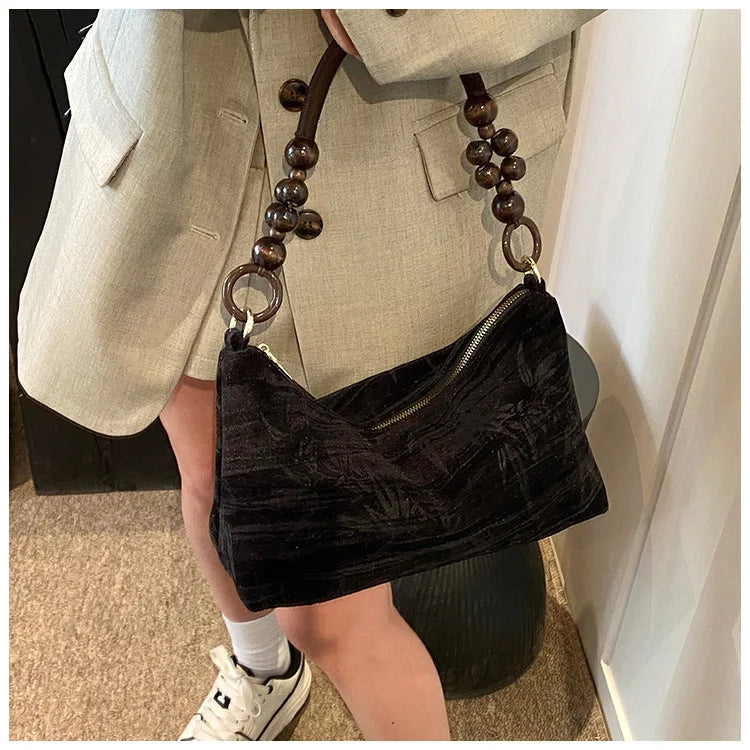 Amblot Corduroy handbag with wooden bead handle