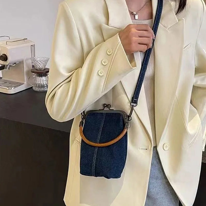 Amblot Distressed denim clutch bag with vintage vibes