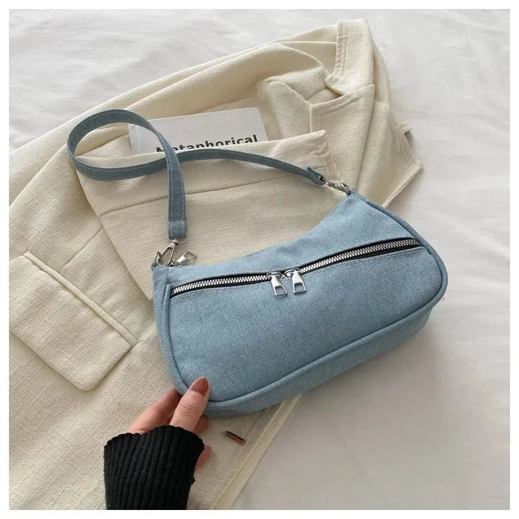 Amblot Light Blue Denim evening clutch bag