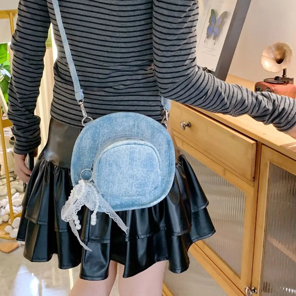 Amblot Light Blue Round denim crossbody bag with fringe and zip closure