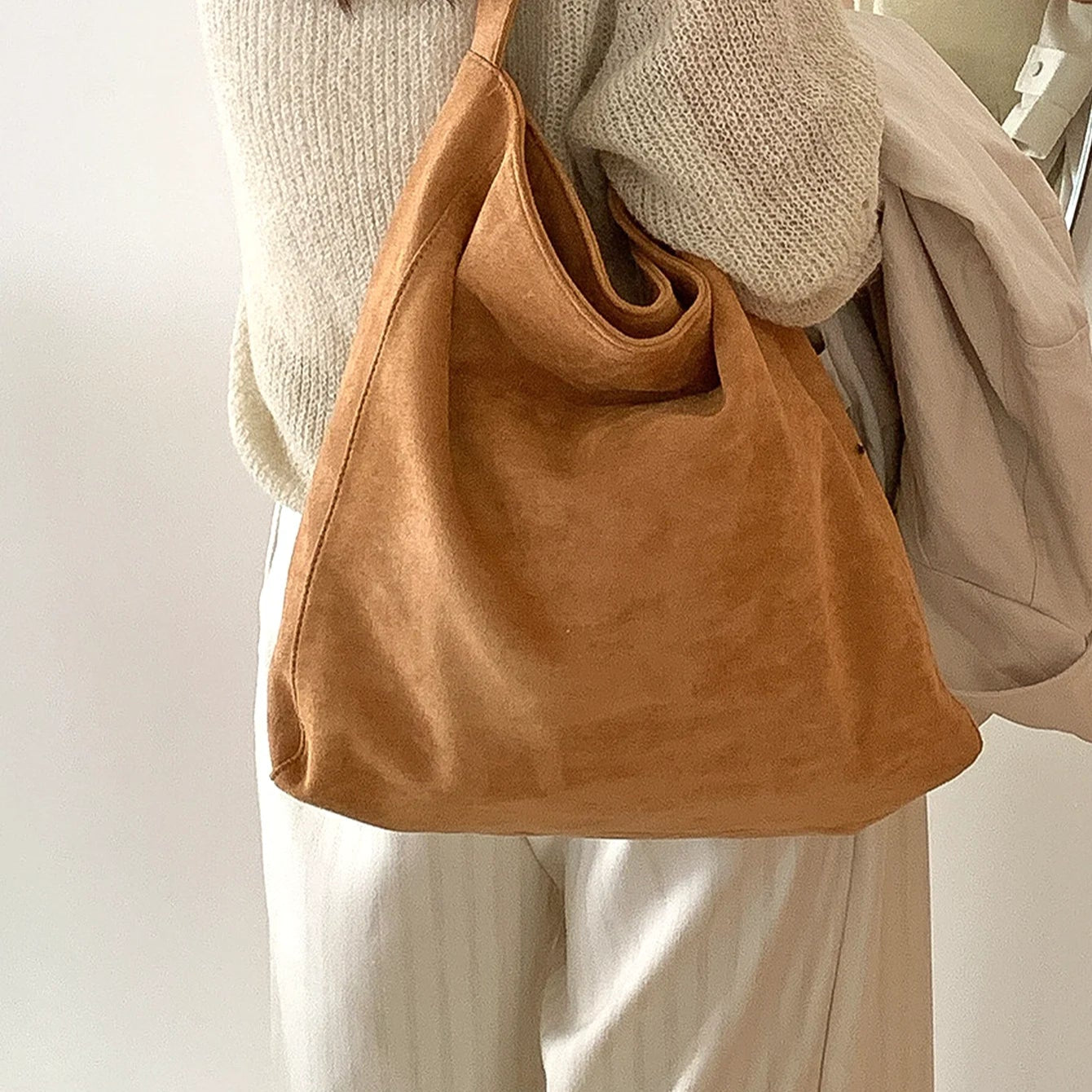 Amblot Light Brown Suede slouch bag with relaxed boho silhouette