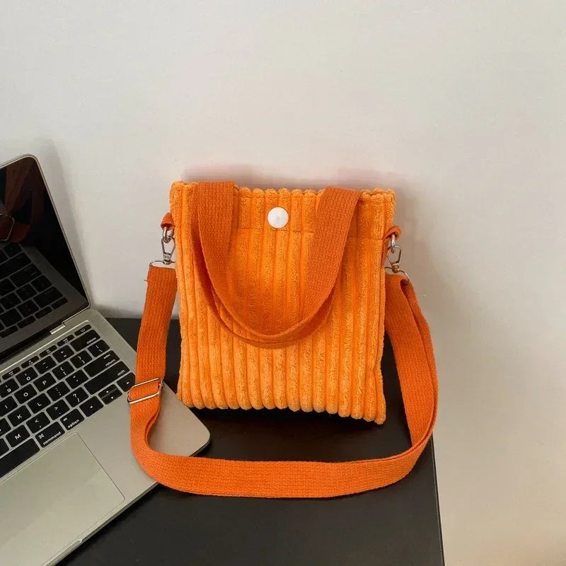 Amblot Orange Corduroy handbag with front button detail