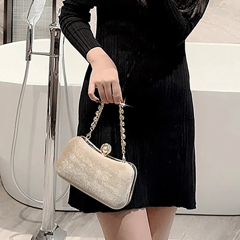 Amblot Rectangular corduroy purse with shiny handle