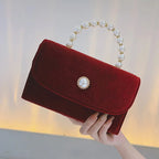 Amblot Red Corduroy clutch bag with envelope flap design