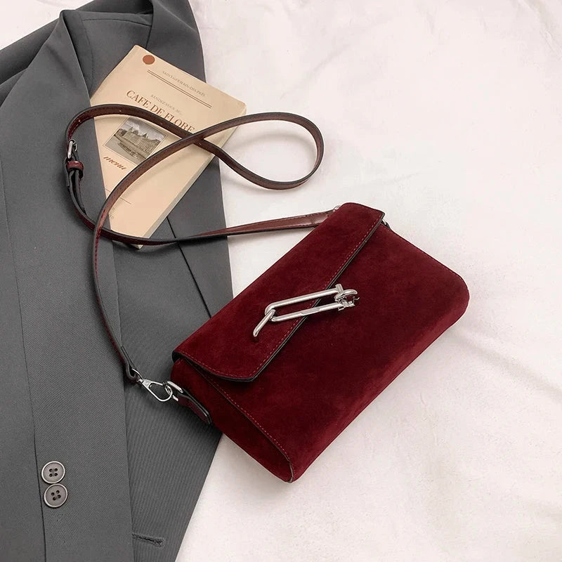 Amblot Red Structured suede handbag with minimalist shape