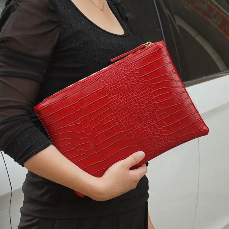 Amblot Red Textured leather clutch