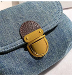 Amblot Retro denim clutch bag with gold buckle closure