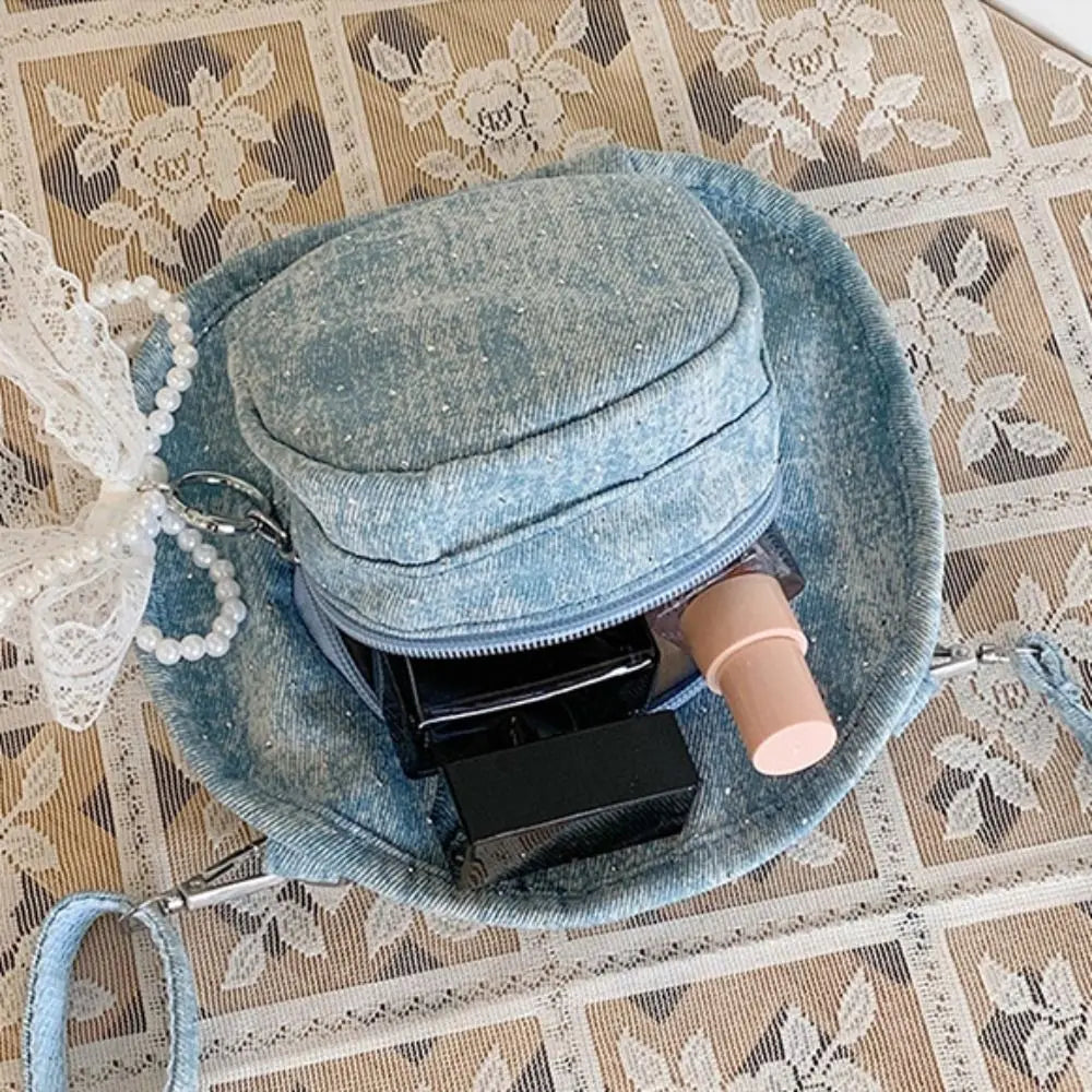 Amblot Round denim crossbody bag with fringe and zip closure