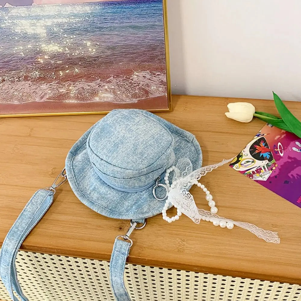 Amblot Round denim crossbody bag with fringe and zip closure