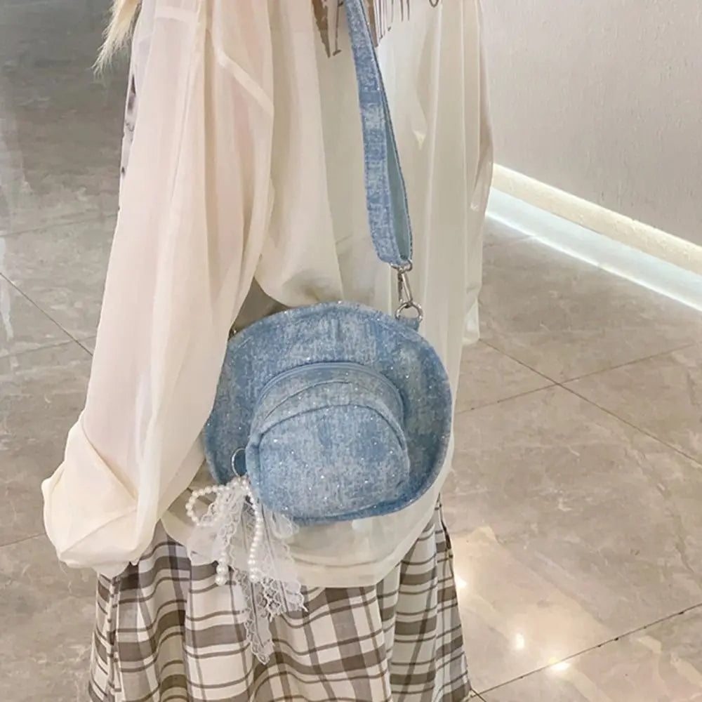 Amblot Round denim crossbody bag with fringe and zip closure