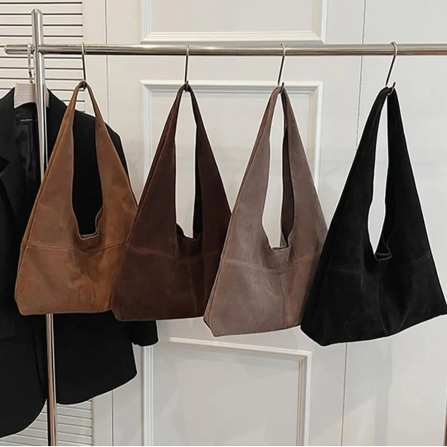 Amblot Slouch-style suede handbag