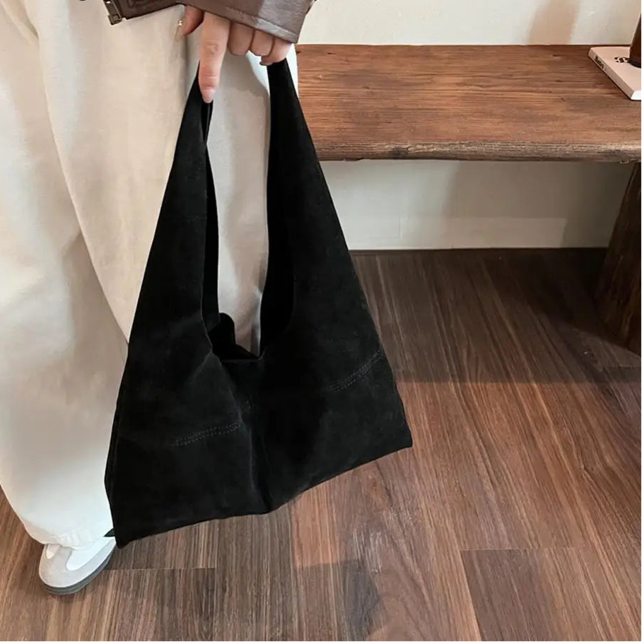 Amblot Slouch-style suede handbag