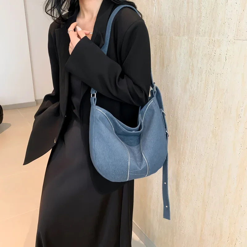 Amblot Soft washed denim shoulder bag with casual fold design