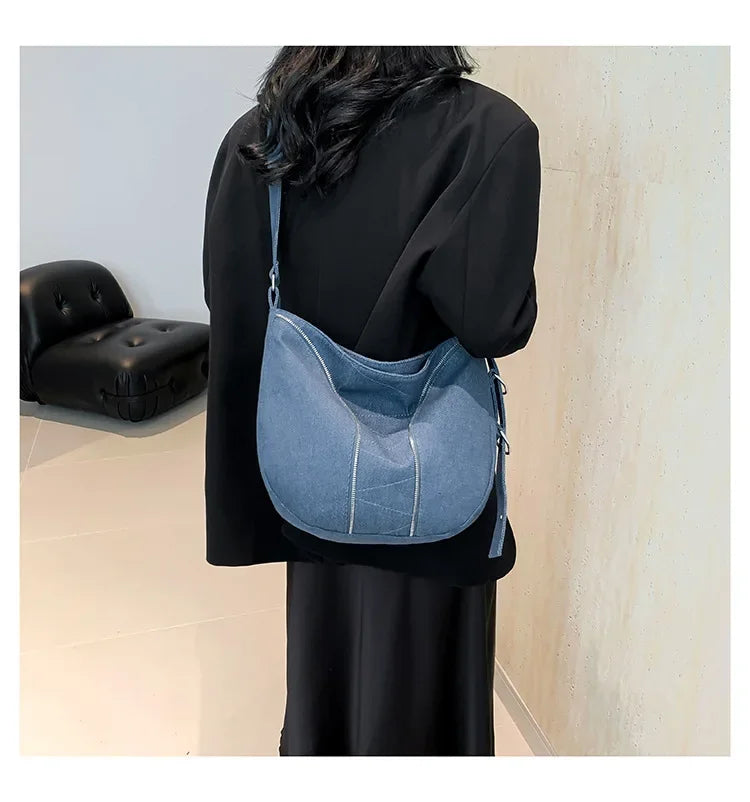 Amblot Soft washed denim shoulder bag with casual fold design