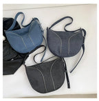 Amblot Soft washed denim shoulder bag with casual fold design