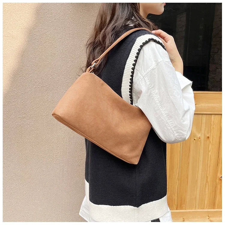 Amblot Structured suede shoulder bag