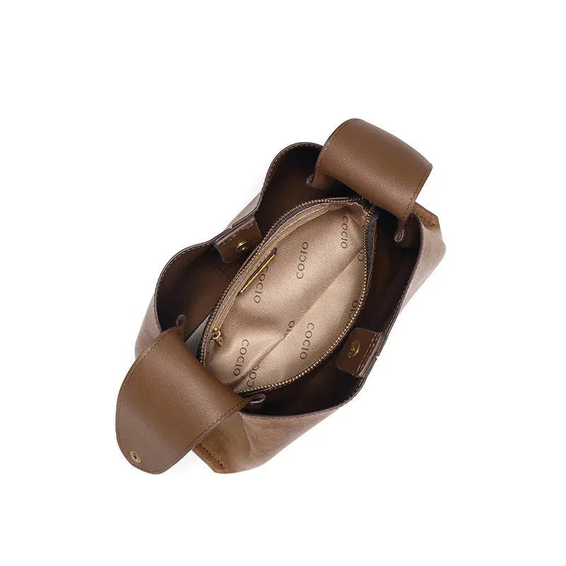 Amblot Suede handbag with rounded handles and zip closure