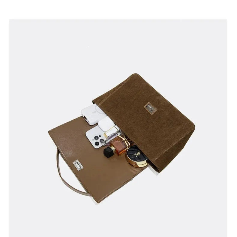 Amblot Textured suede handbag with flap closure