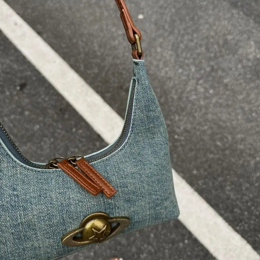 Amblot Trendy blue denim clutch bag with zipper detail